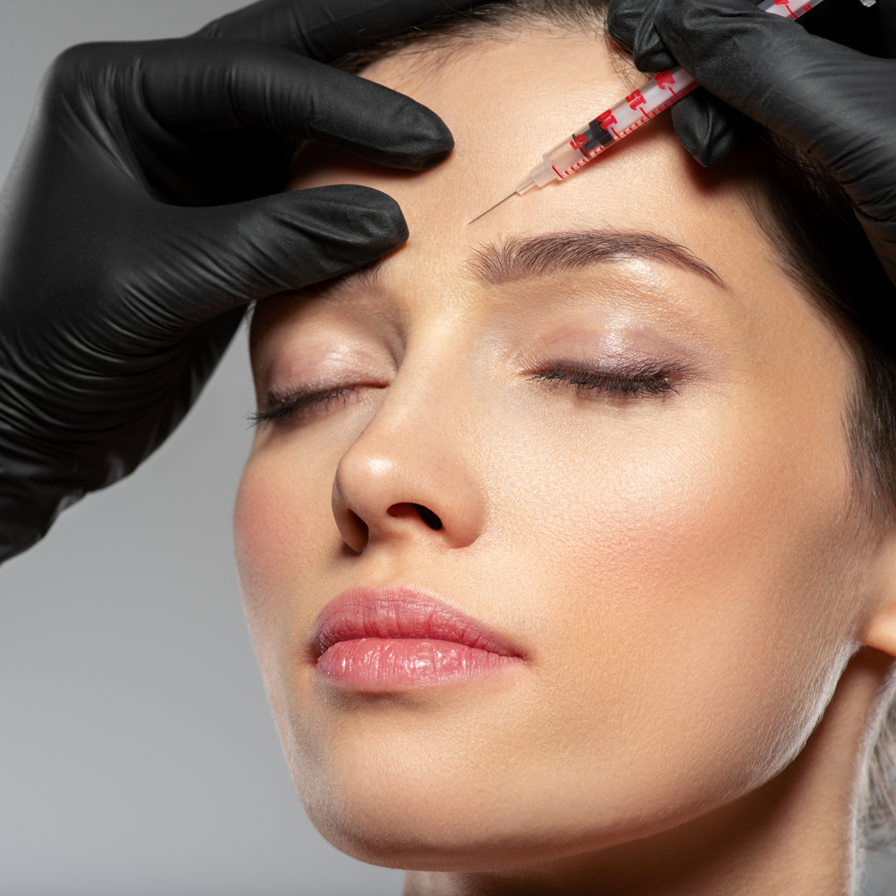 Woman in late 20s gets her first Botox injection as a preventative measure.